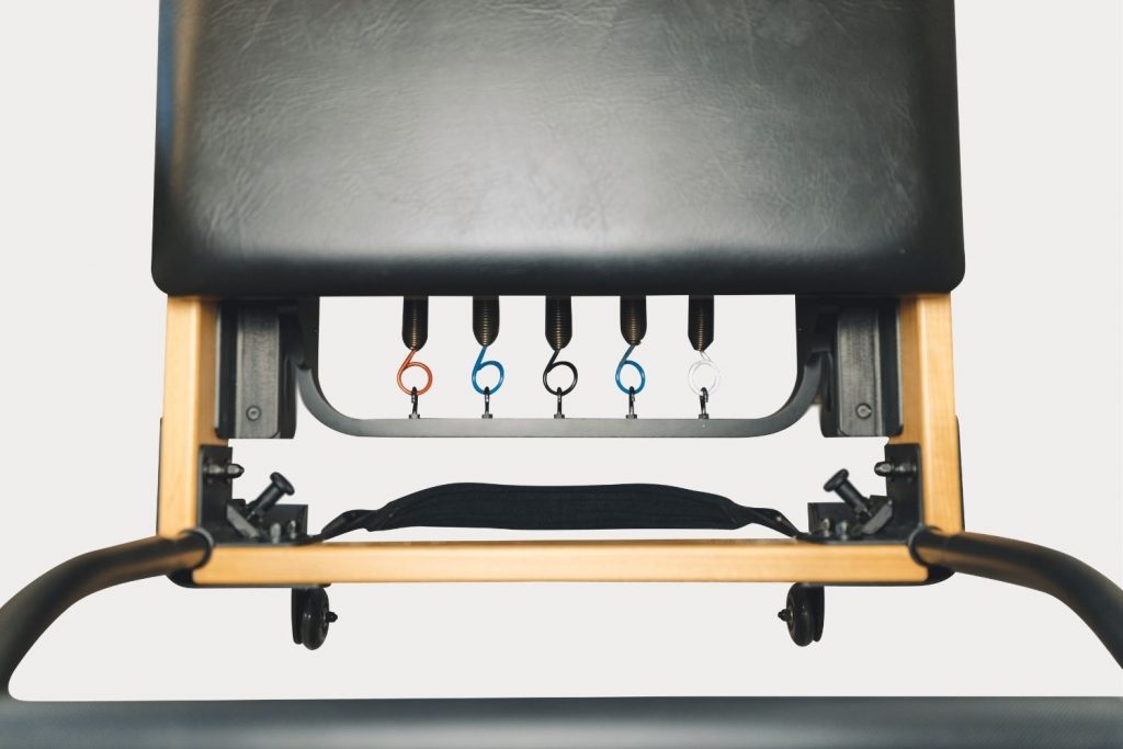 Close-up of the Flexia Smart Reformer spring resistance system.