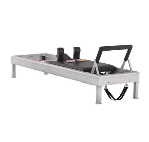 Sleek aluminum Pilates reformer for high-performance training in a Minnesota home.