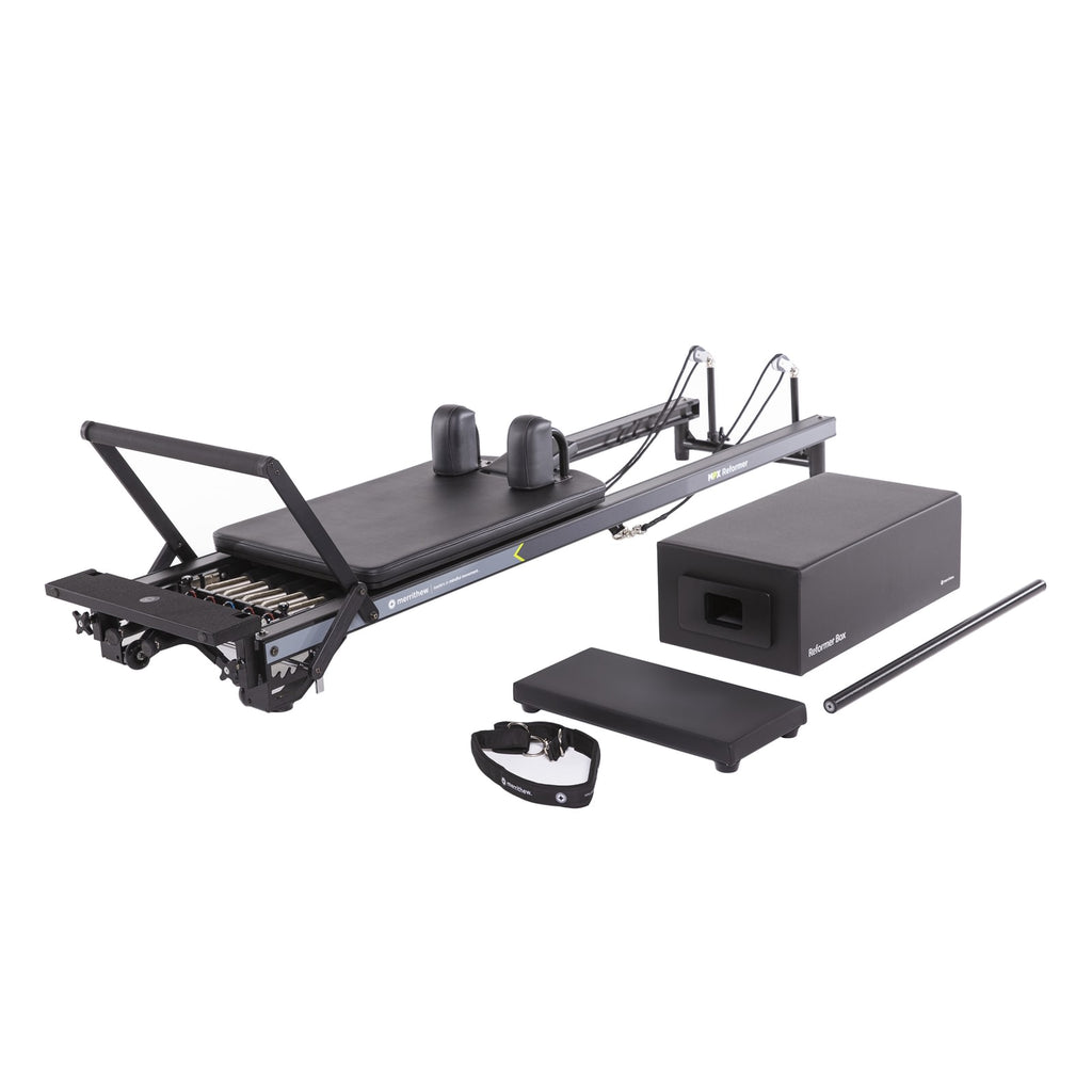 All-black Merrithew luxury Pilates reformer, sleek and modern design.