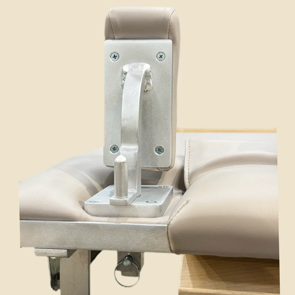 Close-up of removable shoulder blocks on a Gratz Pilates reformer.