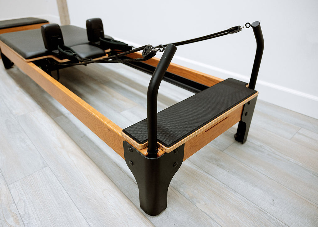 Riser and rope system detail on a luxury Flexia Pilates Reformer.