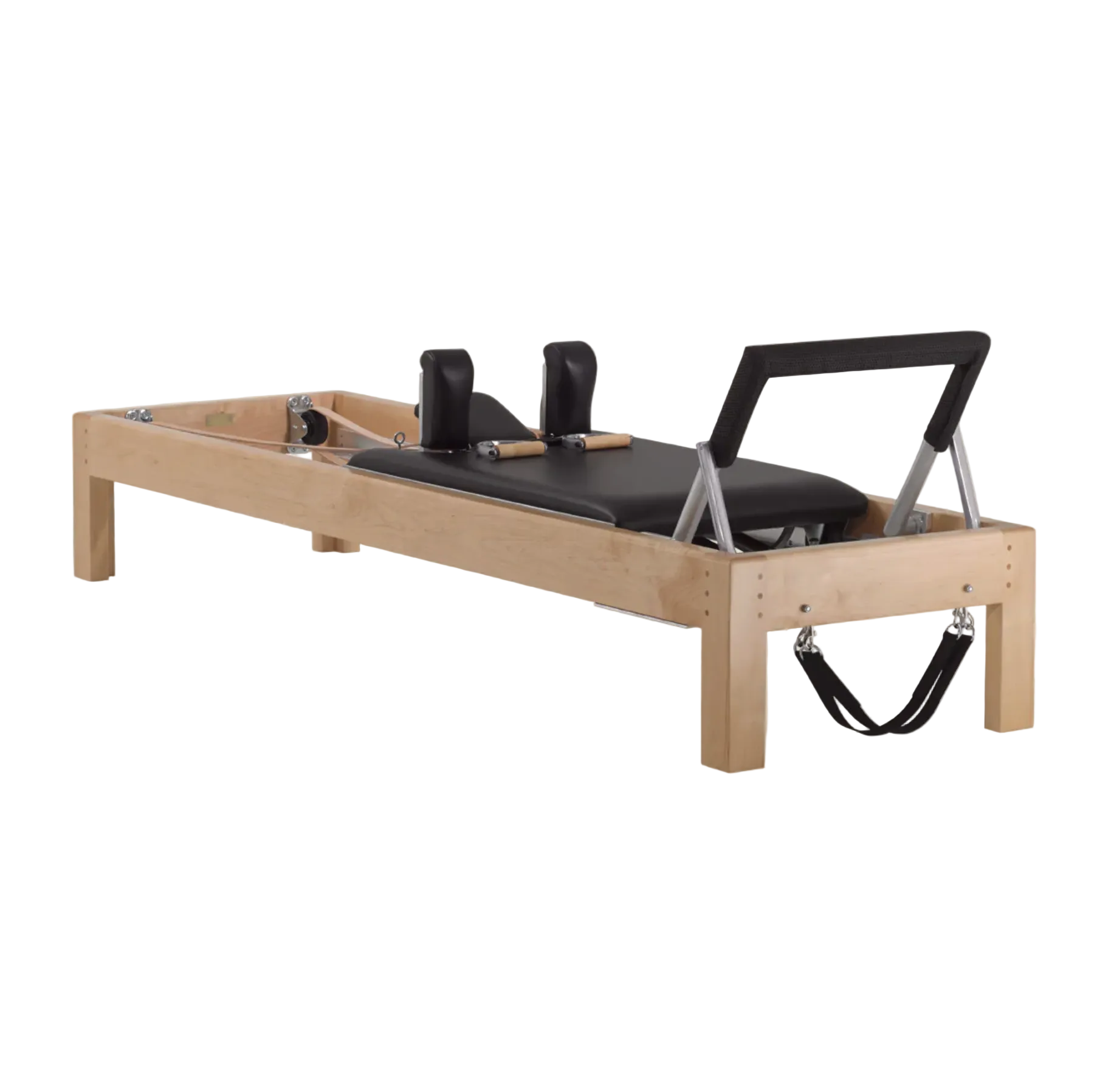 Traditional wood Pilates reformer with black padding, luxury equipment.